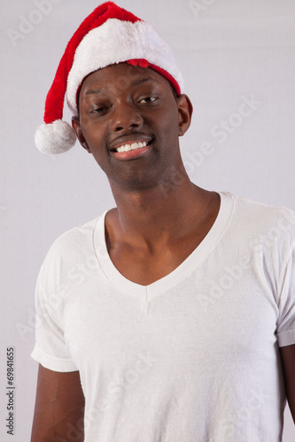 Black man smiling in Santa Hat