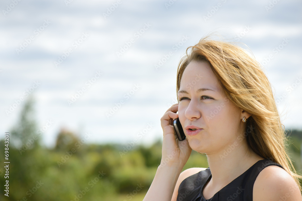 Beautiful caucasian girl talking to smart phone Beautiful caucasian girl talking to smart phone