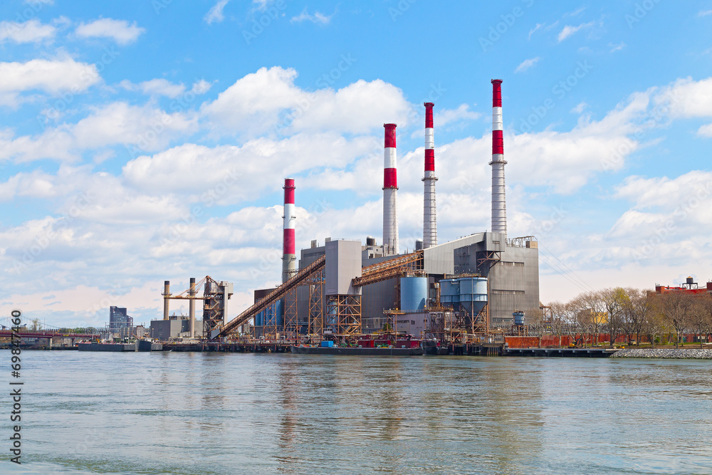 Obraz premium Colorful Power Generating Station near the river.