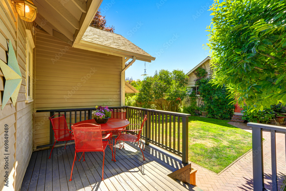 Walkout deck with red table and chairs - obrazy, fototapety, plakaty 