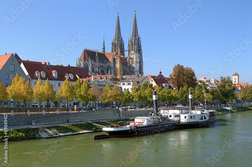 Regensburg Cathedral and old steamship at the shore of Danube