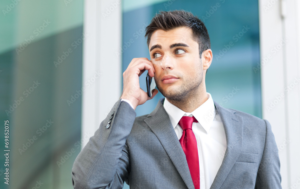 Businessman talking at the phone Businessman talking at the phone