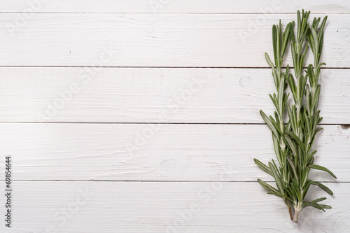 Rosemary on a wooden table  top view