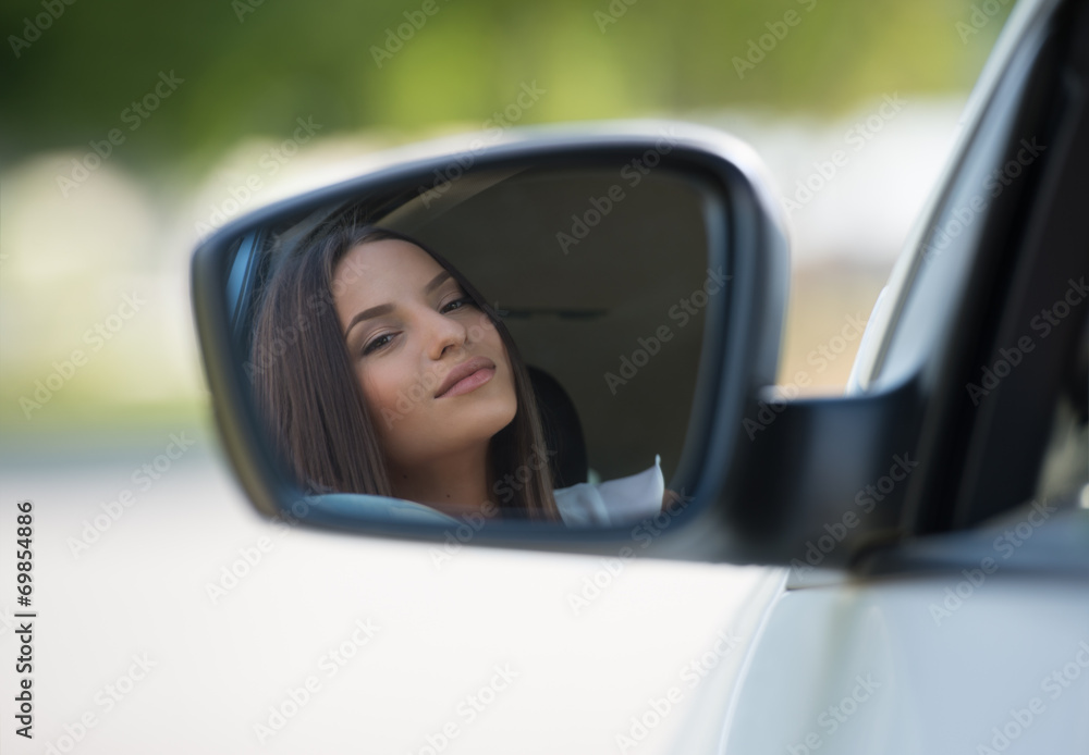 Woman face car mirror