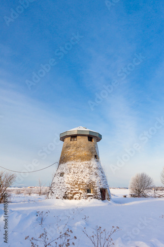 truncated windmill  a house and snow