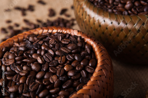 roasted coffee beans in a bamboo basket