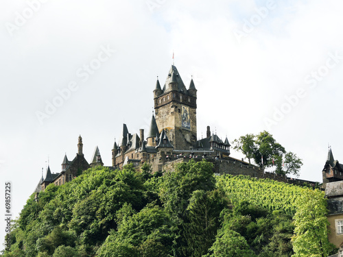 Cochem Imperial castle on green hill in Germany