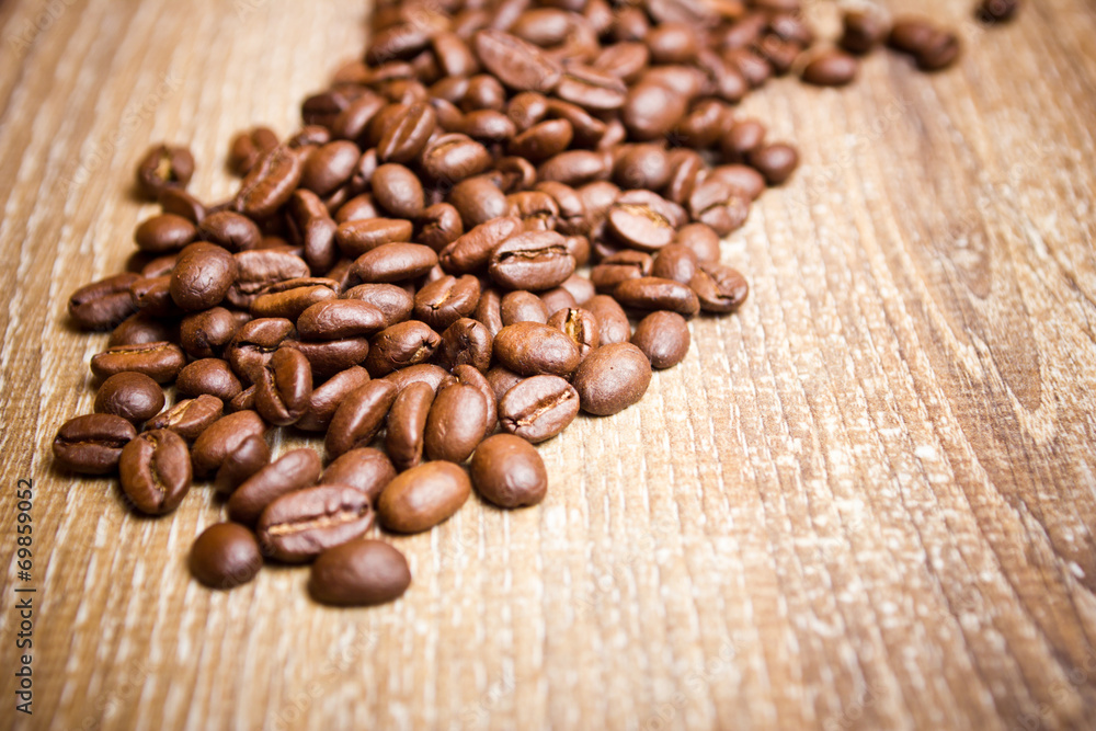Coffee seeds on wooden surface texture. Coffee seeds on wooden surface texture.