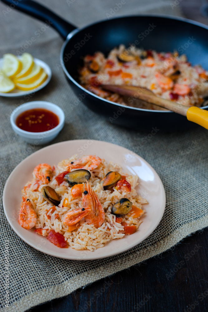 Spanish dish paella with seafood, shrimps in pan Spanish dish paella with seafood, shrimps in pan