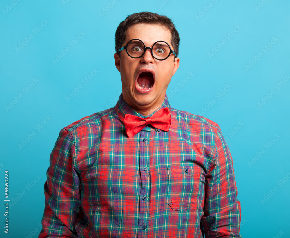 Nerdl man in shirt on blue background. Nerdl man in shirt on blue background.