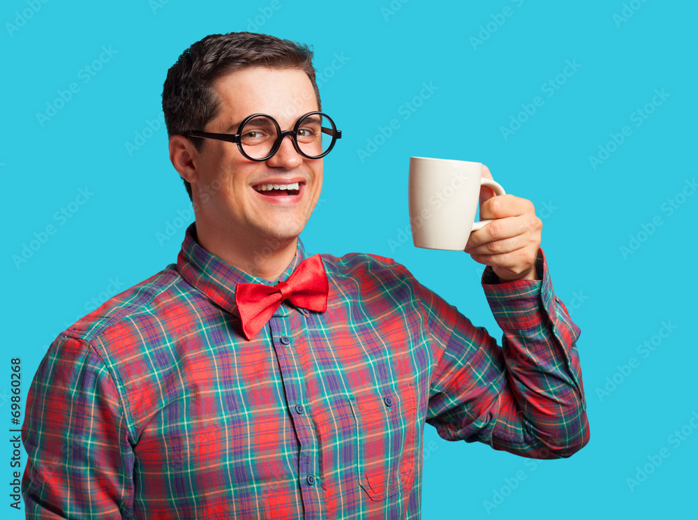 Nerd with cup of coffee on blue background. Nerd with cup of coffee on blue background.