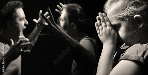 Child prays for peace in the family. photo