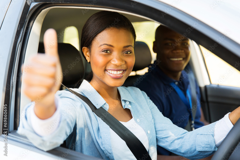 female african learner driver giving thumb up female african learner driver giving thumb up