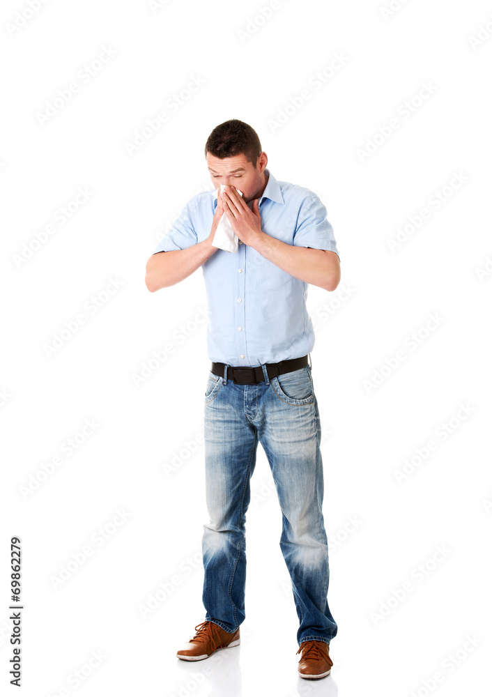 Sick man blowing her nose Sick man blowing her nose