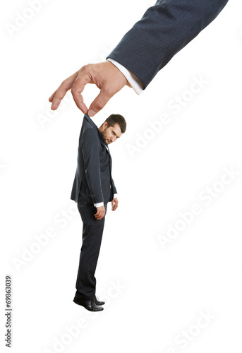 hand holding small discontented man