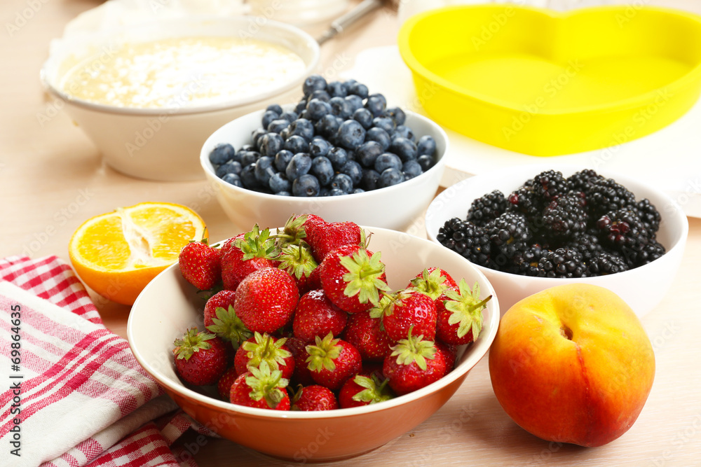 Baking tasty pie and ingredients for it on table in kitchen Baking tasty pie and ingredients for it on table in kitchen
