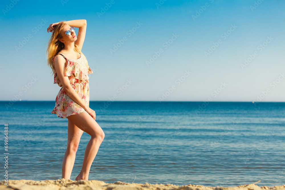 Summer vacation. Girl standing alone on the beach. Summer vacation. Girl standing alone on the beach.