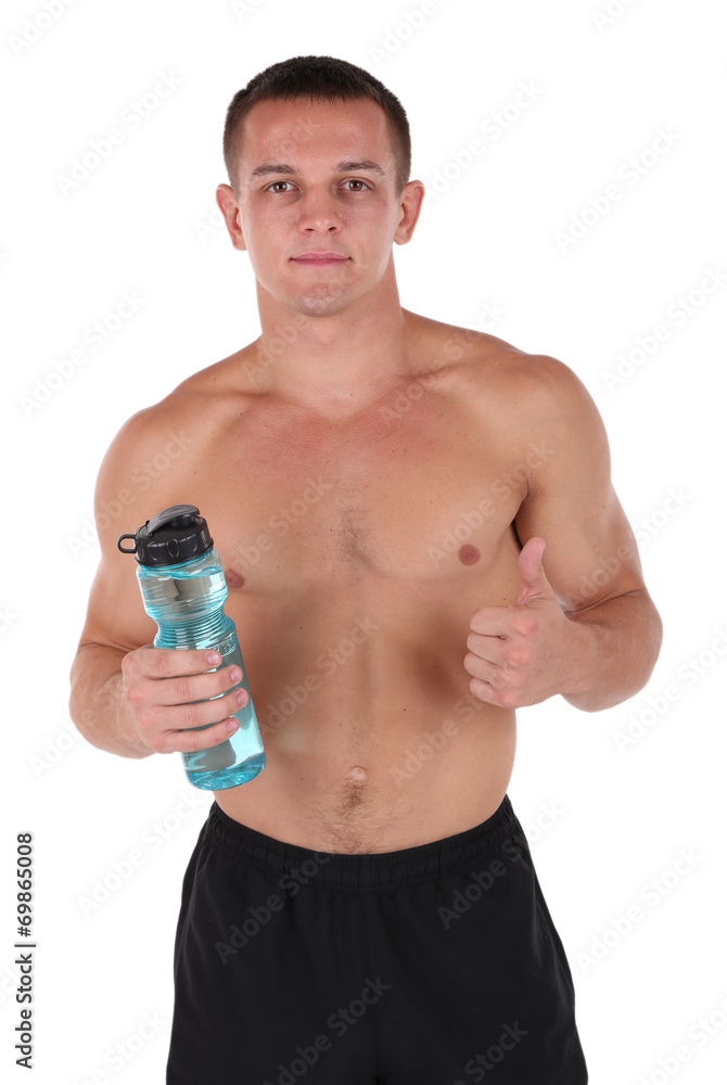 Handsome young sportsman holding bottle with water isolated Handsome young sportsman holding bottle with water isolated
