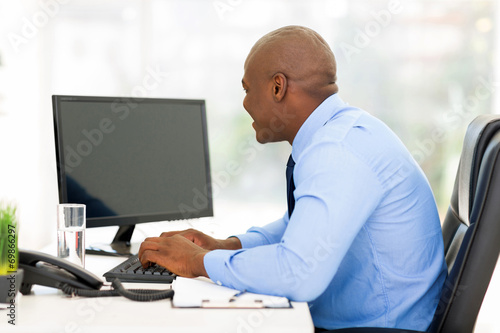 young afro american businessman working on a computer