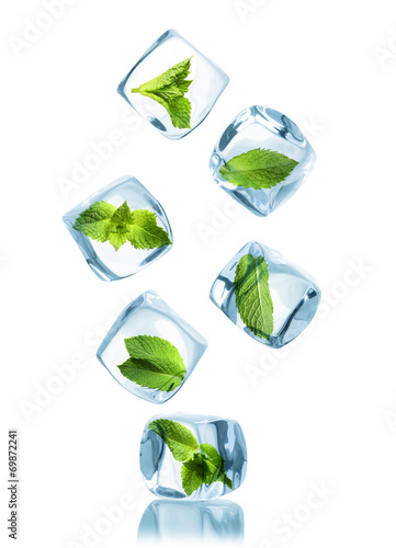 Ice cubes with green mint leaves