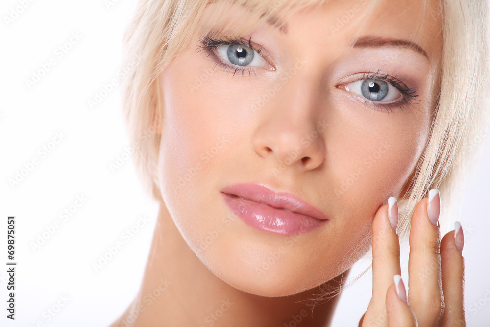 Portrait of young woman touching her face isolated on white Portrait of young woman touching her face isolated on white
