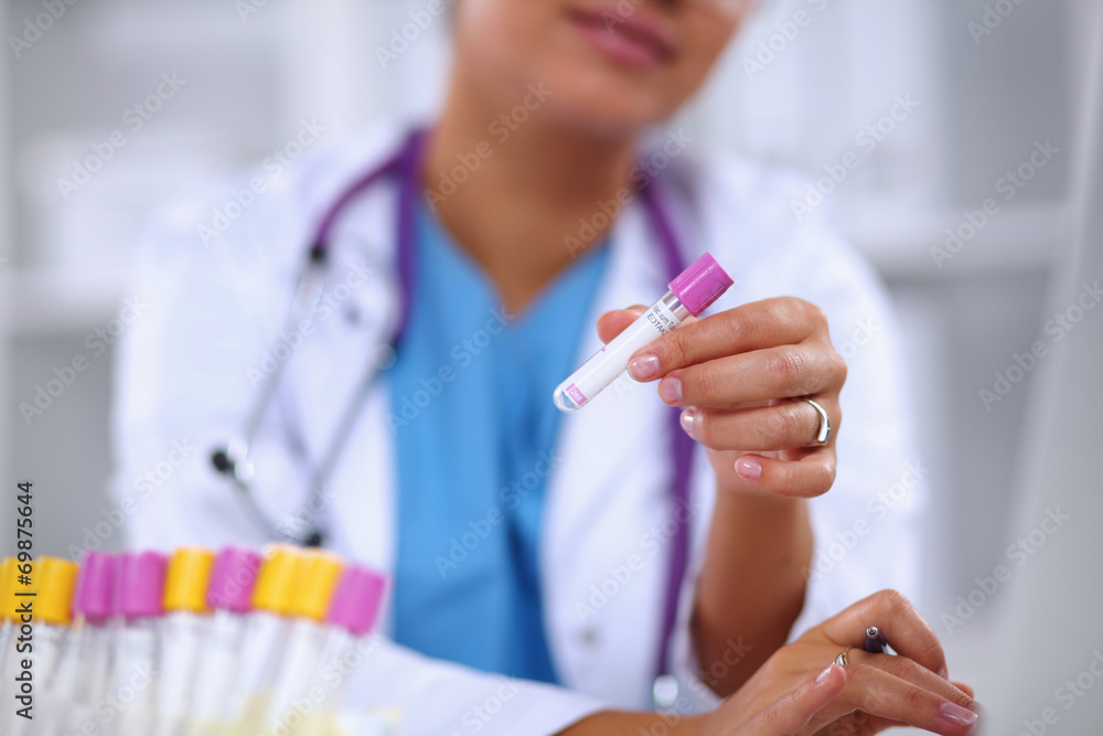 Woman researcher is surrounded by medical vials and flasks, Woman researcher is surrounded by medical vials and flasks,
