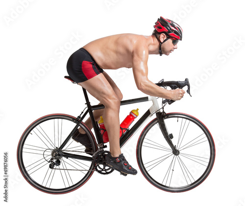 Fototapeta Naklejka Na Ścianę i Meble -  triathlon athlete riding a bicycle