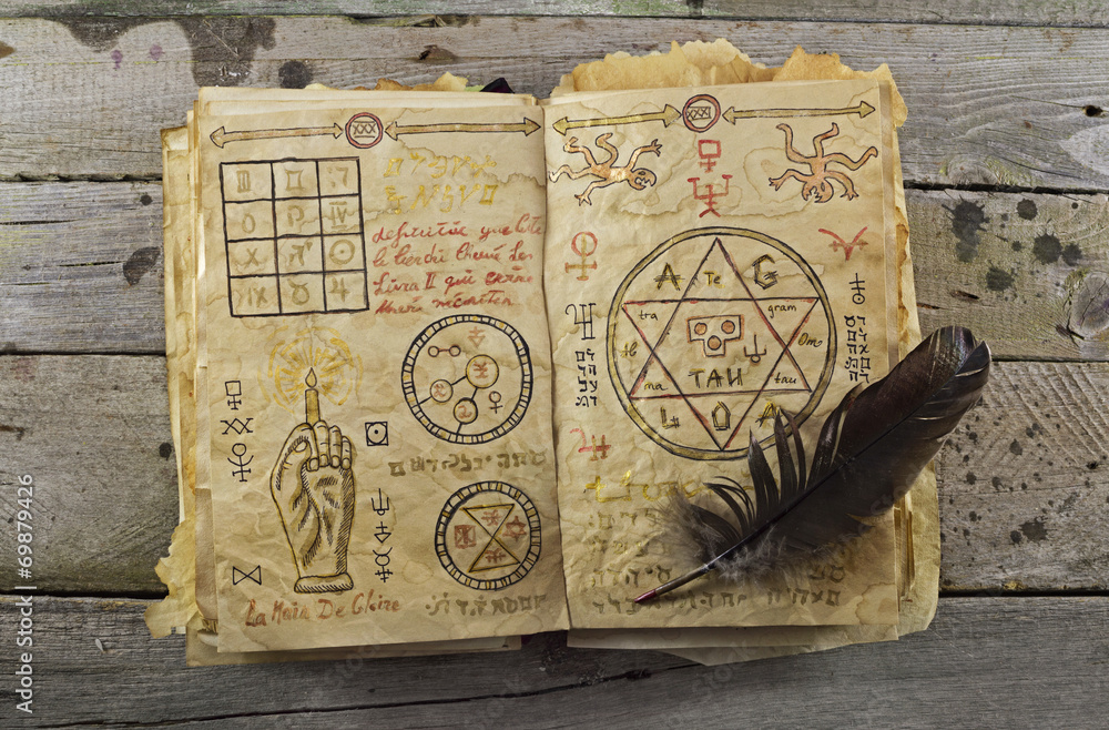Fototapeta premium Magic book on wooden table 1
