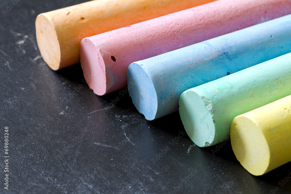 Fototapeta premium Colorful chalk on blackboard