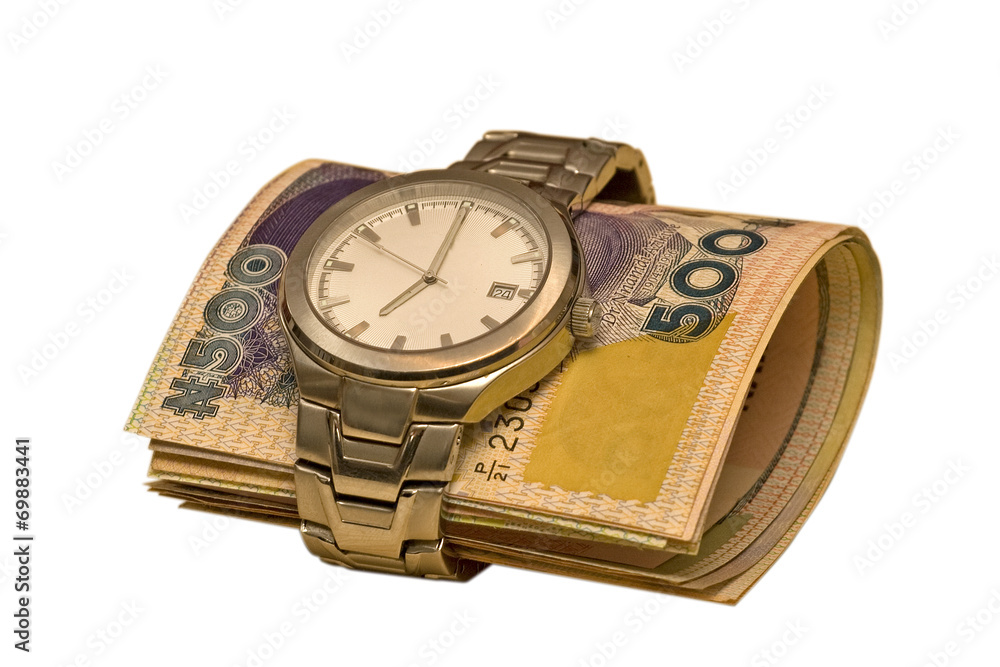 A roll of nigerian money are inserted into a watch A roll of nigerian money are inserted into a watch