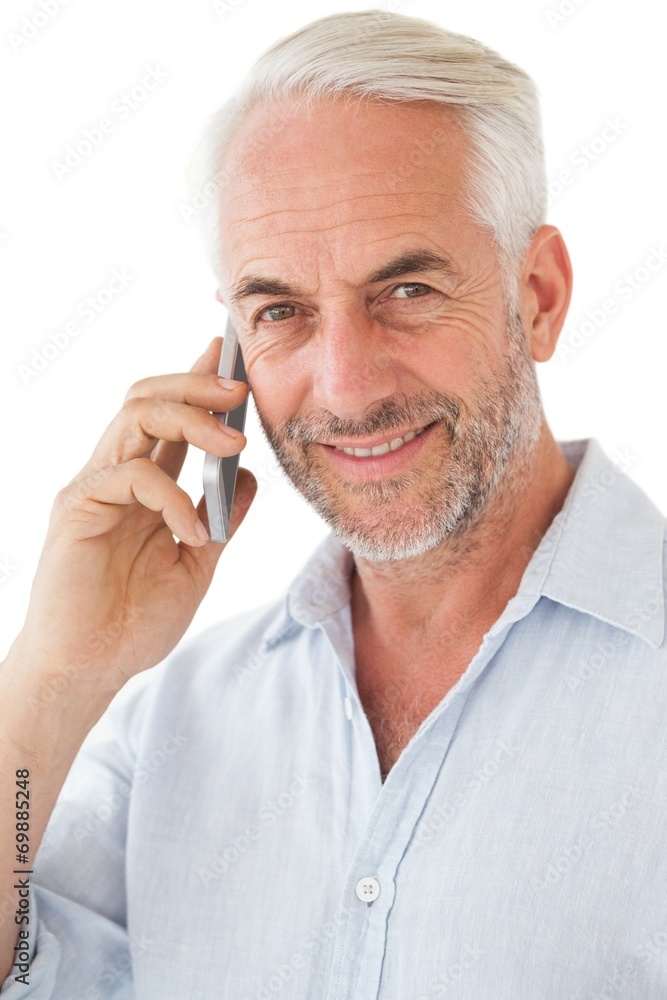 Smiling mature man using mobile phone Smiling mature man using mobile phone