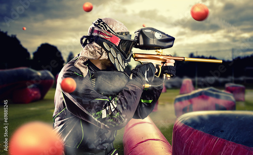 Paintball player in mid gam...