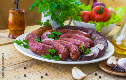 Table plate sliced ​​sausages vegetables
