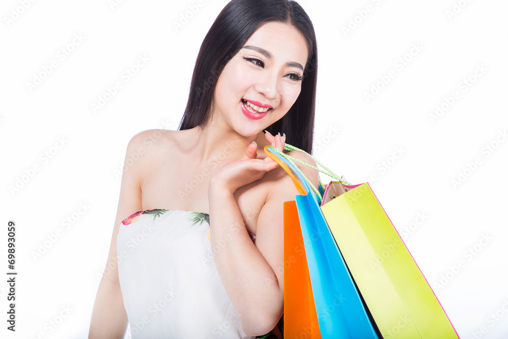 young woman with shopping bags over white background young woman with shopping bags over white background