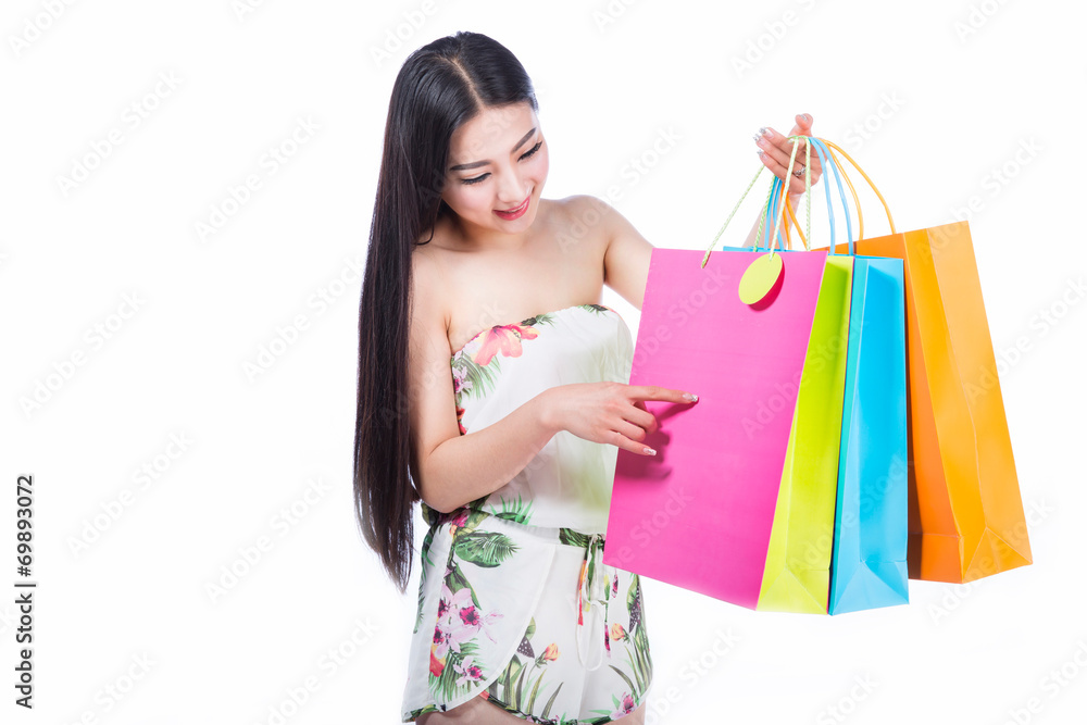 young woman with shopping bags over white background young woman with shopping bags over white background