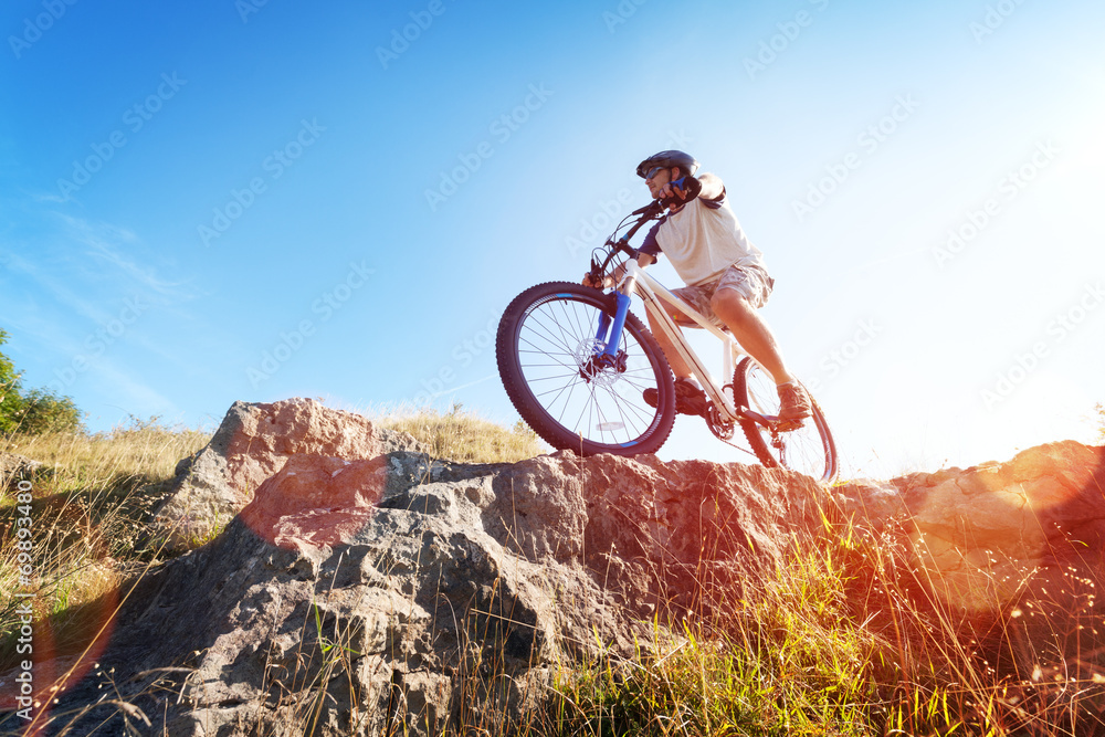 Mountain biker in action - obrazy, fototapety, plakaty 