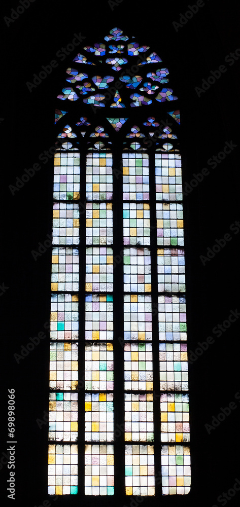 Interior of church with stained glass window designs