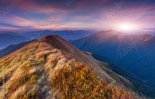 Colorful autumn sunrise in the mountains.