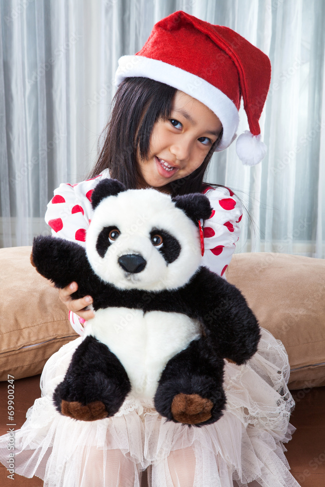 smiling girl in santa helper hat with teddy bear smiling girl in santa helper hat with teddy bear