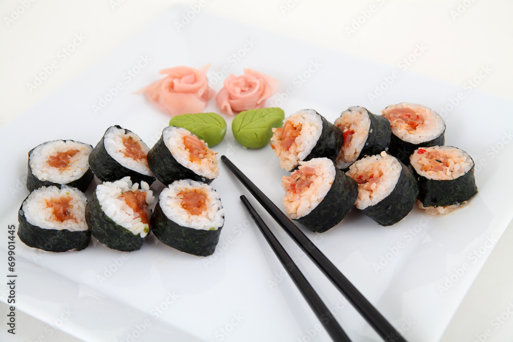 sushi set on white plate. Traditional japanese sushi rolls sushi set on white plate. Traditional japanese sushi rolls