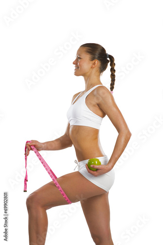 young attractive woman with measuring tape © adam121