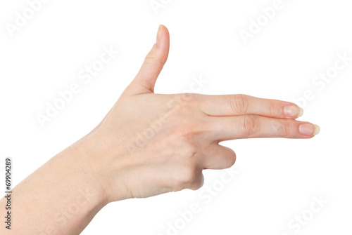 Female hand with fingers pointing or pretending to shoot with a © ibreakstock