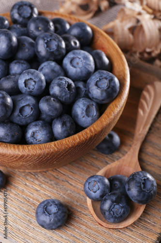 Wooden bowl of blueberries