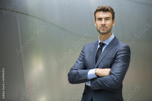 Portrait of confident businessman outside photo