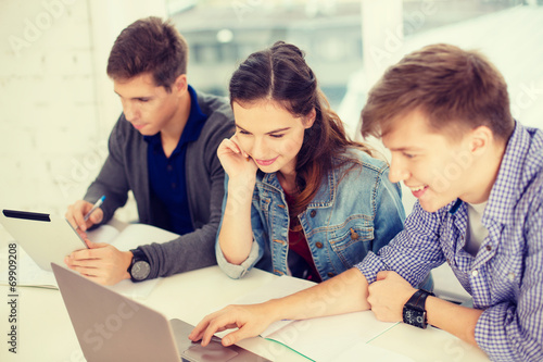 students with laptop, notebooks and tablet pc