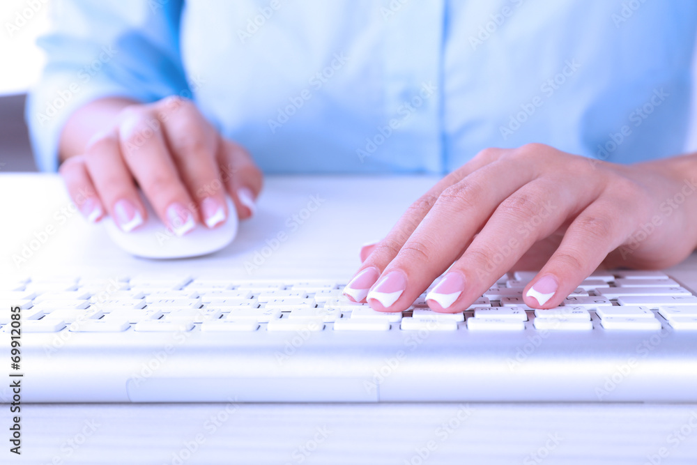 Female hands typing on keyboard, close-up Female hands typing on keyboard, close-up