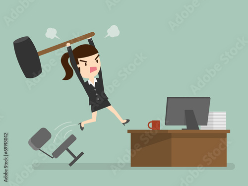 Furious frustrated business woman hitting the computer