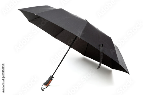 Modern black umbrella in the unfolded form isolated on white bac