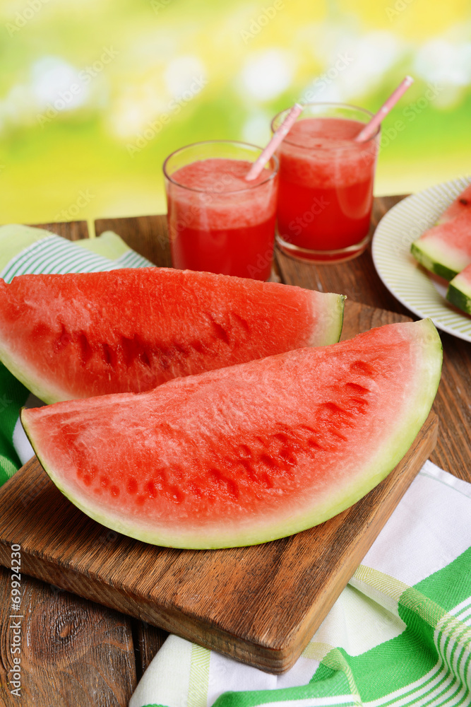 Juicy watermelon on table on bright background Juicy watermelon on table on bright background