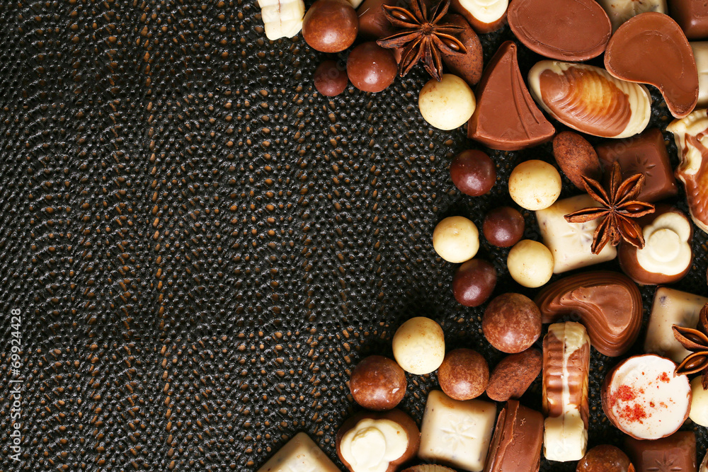 Different kinds of chocolates on dark background